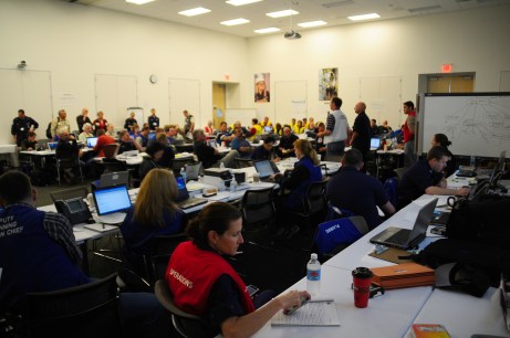 HOUMA, La. -- Members of the unified response for the Deepwater Horizon oil spill listen to the command members give an update at the unified command center in Houma, La. April, 25, 2010. The command is made up of representatives of the U.S. Coast Guard, BP, the Marine Spill Response Corporation, National Response Corporation, National Oceananic and Atmospheric Administration, Louisiana Department Fish and Wildlife along with local, state and federal agencies. U.S. Coast Guard photo by Petty Officer 3rd Class Stephen Lehmann.