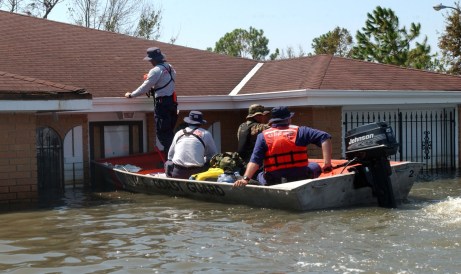 A Coast Guard Disaster and Response Team or “DART” works with an Urban Search and Rescue Team from Miami to carry out the tedious job of marking houses they’ve searched for survivors or bodies.